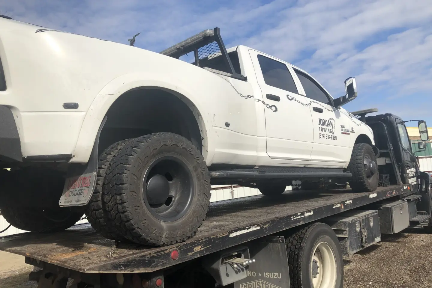 Ram dually pickup on a Dawson Tow Service flatbed in Dallas, TX