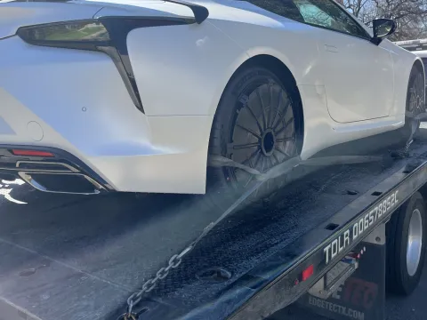 Lexus LC coupe strapped on a flatbed in Dallas, TX
