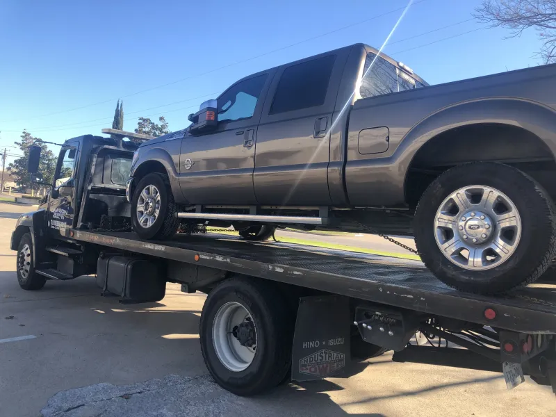 Ford F-250 on a Dawson Tow Service flatbed for long distance towing from Dallas, TX