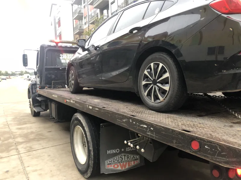 Sedan on a Dawson Tow Service flatbed in Dallas, TX