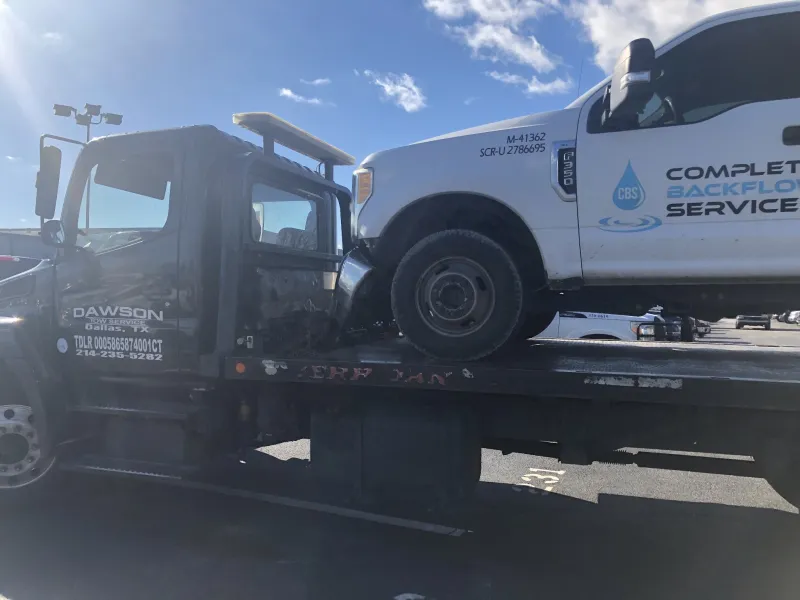 Work truck on a Dawson Tow Service flatbed in Dallas, TX